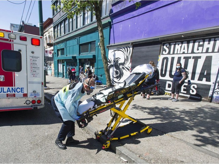  Paramedics respond to an emergency medical call in the 100-block E. Hastings Street in Vancouver, BC Thursday, April 22, 2021.