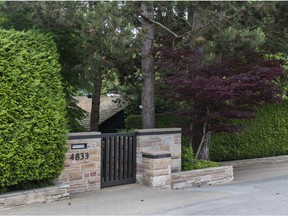 Behind this unassuming gate is a Vancouver mansion bought by a "student" for $31 million, in a common practice that has distorted Canadian real-estate prices.