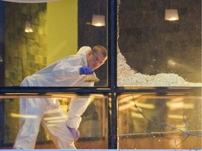Investigators look for clues at the scene of the Wall Centre shooting in 2012.