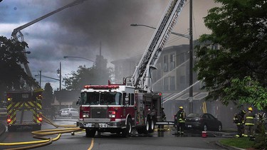 Firefighters battle a massive fire in a condominium construction site near Johnston Road and Buena Vista Avenue in the Five Corners area of White Rock on May 15, 2016.