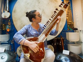 Chidroopa Lok plays a sitar at Gandharva Loka World Music Instruments in Vancouver on July 1.