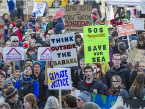 Thousands of people rally at the Vancouver Art Gallery and march through the city to bring attention to the global climate change issue.