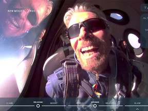 Billionaire Richard Branson reacts on board Virgin Galactic's passenger rocket VSS Unity after reaching the edge of space above Spaceport America, near Truth or Consequences, New Mexico, on July 11.