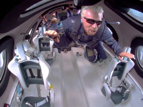 Billionaire Richard Branson floats in zero gravity on board Virgin Galactic's passenger rocket plane VSS Unity after reaching the edge of space above Spaceport America near Truth or Consequences, New Mexico, on July 11.