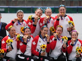 Gold medalists Lisa Roman, Kasia Gruchalla-Wesierski, Christine Roper, Andrea Proske, Susanne Grainger, Madison Mailey, Sydney Payne, Avalon Wasteneys and Kristen Kit of Canada pose during the medal ceremony for the women's rowing eight final lat the 2020 Summer Olympics, Friday, July 30, 2021, in Tokyo, Japan.