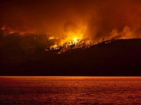 The White Rock Lake fire burns near Vernon's Westside on Friday evening (Aug. 6, 2021). In the top left of the image you can see the ember shower. Photo: Courtesy of Steve Wensley, Prime Light Media.