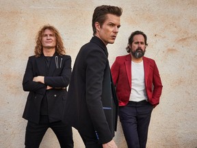 The Killers, featuring (from left to right) guitarist Dave Keuning, singer Brandon Flowers and drummer Ronnie Vannucci Jr., released Pressure Machine in 2020.