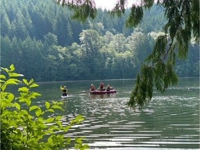RCMP and search and rescue crews have recovered the body of a paddle boarder who fell into Alice Lake in Squamish Sunday.