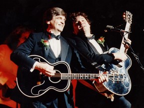 The Everly Brothers, Phil Everly (left) and Don Everly (right), perform at Toronto's Roy Thomson Hall in 2009.