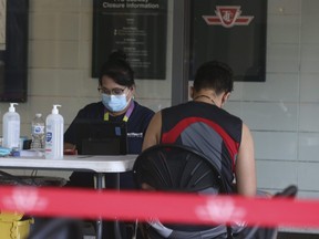 People in Toronto lined up and got their vaccinations at a TTC pop-up clinic at Victoria Park subway station on Tuesday, August 24, 2021.