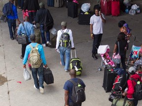 A flood of refugees arrive at Olympic Stadium in Montreal.