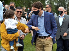 Canada's Prime Minister Justin Trudeau greets people at Town Centre Park in Coquitlam, British Columbia, Canada July 8, 2021.