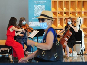 Members of the Vancouver Symphony Orchestra (VSO) perform at the vaccination clinic at the Vancouver Convention Centre on June 24, 2021.