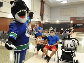 Scenes from a "Walk-in Wednesday" clinic at the Italian Cultural Centre in Vancouver on August 4, 2021.