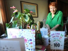 Eva Mossop, pictured in her West End home on Thursday, with stacks of birthday cards from well wishers.
