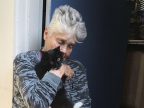 Carel Moiseiwitsch with one of her cats (not the one that died in the wildfire). She lost her home, art and cherished memorabilia.