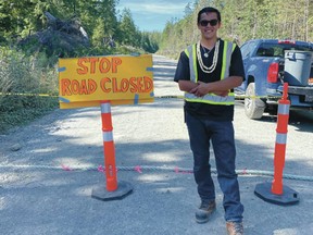 Tim Masso, at the road block he set up on West Main near Ucluelet to turn away tourists. Some tourists have been leaving a mess and creating fire hazards.
