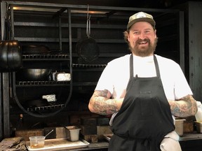 Chef Derek Gray stands in front of his wood-fired oven at Row Fourteen Restaurant at Klippers Organics in the Similkameen Valley.