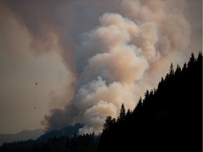 The July Mountain wildfire burns along the Coquihalla Highway south of Merritt on Wednesday, Aug. 11, 2021.