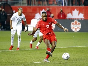 Canadian striker Cyle Larin scores on a second-half penalty against Honduras during their World Cup qualifying match at BMO Field in Toronto on Thursday night. Canada and Honduras played to a 1-1 draw.