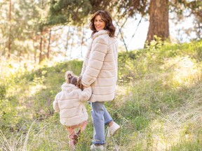 Jillian Harris and her daughter Annie wear the faux-fur jacket from her latest collaboration with Joe Fresh.