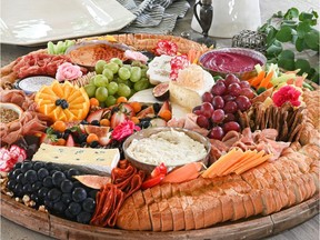 The hummus board, overflowing with cheese, charcuterie, dips, bread and accoutrements, from The Graze Company.