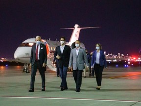 Prime Minister Justin Trudeau welcomes Michael Kovrig and Michael Spavor back to Canada at Calgary airport Saturday morning.