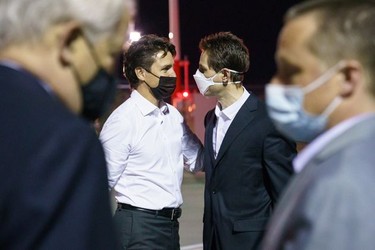 Prime Minister Justin Trudeau welcomes Michael Kovrig and Michael Spavor back to Canada at Calgary airport Saturday morning.