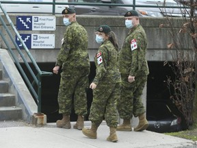 Canadian military personnel walk the grounds at Sunnybrook Hospital to assist in COVID relief, April 30, 2021.