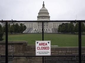 The U.S. Capitol stands behind security fencing on Sept. 17, 2021 in Washington, D.C.