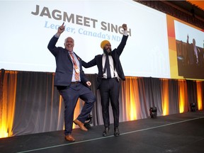 Federal NDP Leader Jagmeet Singh and B.C. Premier John Horgan celebrate during the BC NDP Convention at the Victoria Convention Centre in Victoria, B.C., on Saturday, November 23, 2019.