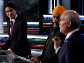 Justin Trudeau, Jagmeet Singh, and Erin O'Toole take part in the federal election English-language leaders debate in Gatineau earlier this month.