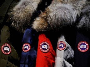 Jackets hang in the showroom of the Canada Goose factory in Toronto on Feb. 23, 2018.