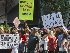 Hundreds of protesters gathered at Yonge Dundas Square to protest Covid-19 safety measures and the lockdown on Saturday September 26, 2020.
