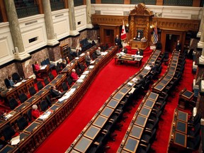 A dozen MLAs gather in the legislative assembly in 2020, while most participated by Zoom.