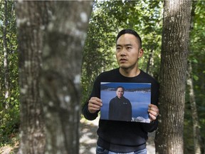 Sam Noh holds a pictures of his father, Shin Noh, who went missing in Coquitlam in 2013. Noh, who had Alzheimer's disease, has never been found.
