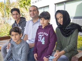 Afghan journalist Mujeeb Khalvatgar with four of his six children. He is a refugee, former journalist and was head of a journalism training program that had more than 2,000 graduates, most of whom are now at risk.