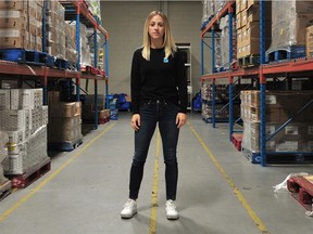 Emily-anne King, vice-president of the charity Backpack Buddies that helps hungry schoolchildren in B.C., is pictured in their warehouse in North Vancouver on Sept. 2.