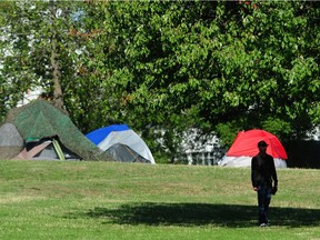 The Vancouver park board started bringing down the fences surrounding the east side of Strathcona Park on Tuesday.