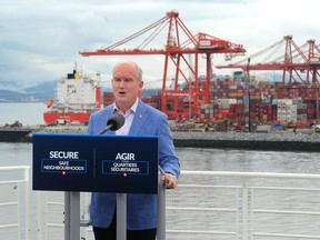 Conservative party leader Erin O'Toole campaigning in Vancouver, with the container port as a backdrop, at Canada Place on Sunday. The Tories hope to make further inroads in B.C. from the 2019 vote, when they captured 17 seats in the province.