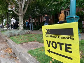 VANCOUVER, B.C.: September 20, 2021 - Voters line-up around the block at Holy Trinity Ukranian Orthodox Cathedral and Auditorium at 154 East 10th Avenue in Vancouver on September 20, 2021. Election 2021. Mike Bell iPhone photo. [PNG Merlin Archive]