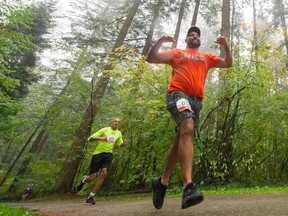 Runners brave the rain during the Rainforest Trail Run through Burnaby's Central Park on Sunday.