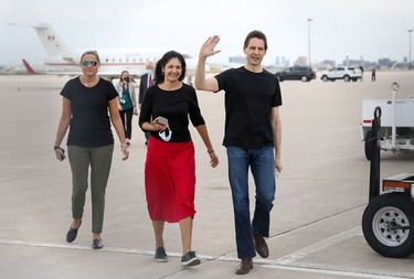 Former diplomat Michael Kovrig, his wife Vina Nadjibulla and sister Ariana Botha react following his arrival on a Canadian air force jet after his release from detention in China, at Pearson International Airport in Toronto, Ontario.