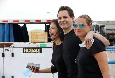 Former diplomat Michael Kovrig, his wife Vina Nadjibulla and sister Ariana Botha react following his arrival on a Canadian air force jet after his release from detention in China, at Pearson International Airport in Toronto, Ontario.