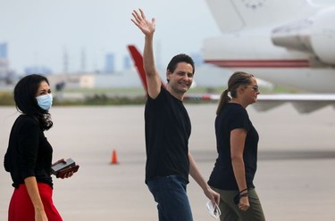 Former diplomat Michael Kovrig, his wife Vina Nadjibulla and sister Ariana Botha walk following his arrival on a Canadian air force jet after his release from detention in China, at Pearson International Airport in Toronto, Ontario.
