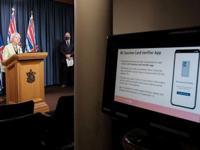 Premier John Horgan watches as Dr. Bonnie Henry, provincial health officer, discusses plans for the B.C. Vaccine Card, a digital or printed document that shows the stage cardholders are at in their COVID-19 vaccine progress. [PNG Merlin Archive]