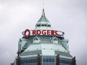 A sign is pictured on top of the Rogers Communications Inc. building in Toronto.