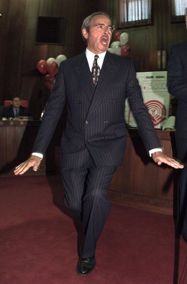 Dancing to the strains of 'New York, New York' at a karaoke kick-off to the United Way's employee workplace campaign in 1996.