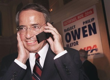 1999. Mayor Philip Owen receives a congratulatory phone call at the NPA 's victory party at the Hotel Georgia , Saturday night.
