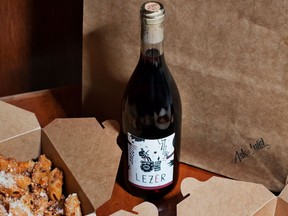 A takeout meal with a bottle of wine from Ask for Luigi in Vancouver's Gastown.
